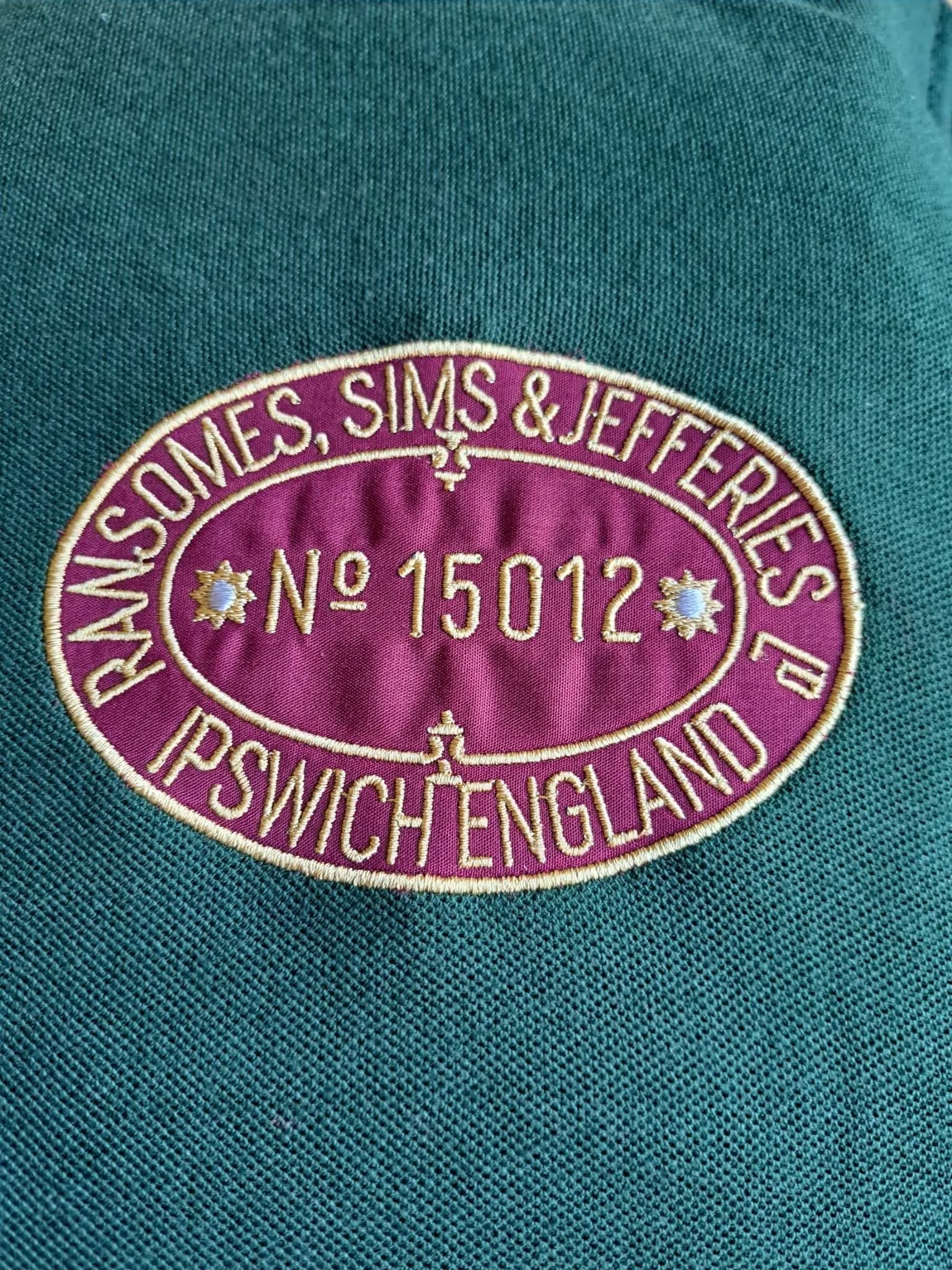 Appliqué train badge on a polo shirt