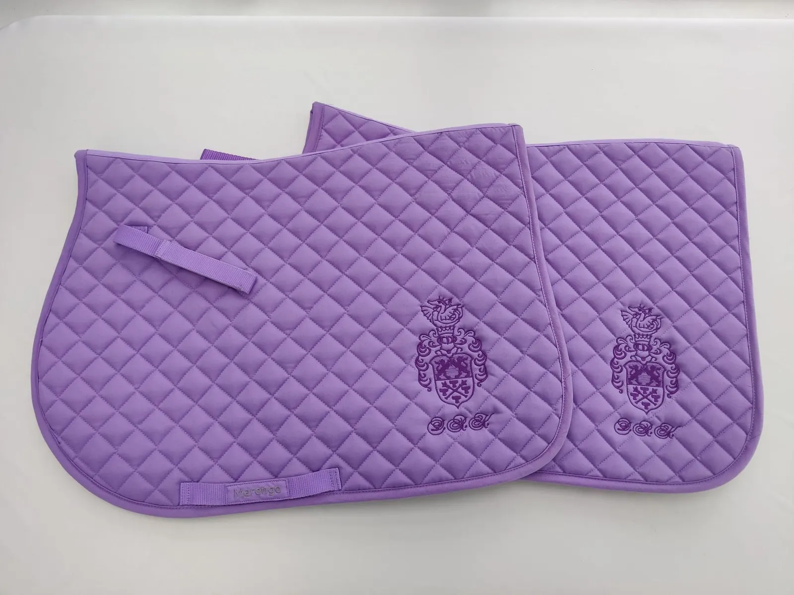 Personalised saddle pad with a family crest