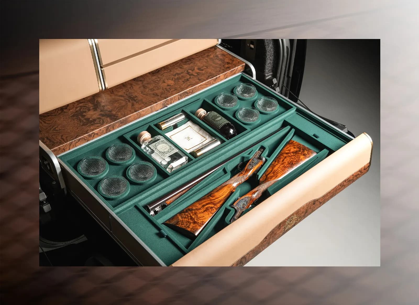 H&H picnic hamper set with glasses, flask and cased shotguns fitted into a car boot