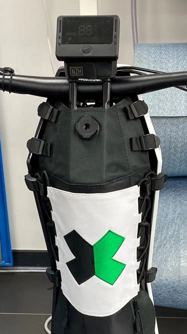 Removable embroidered sponsorship panel for a motorcycle tank