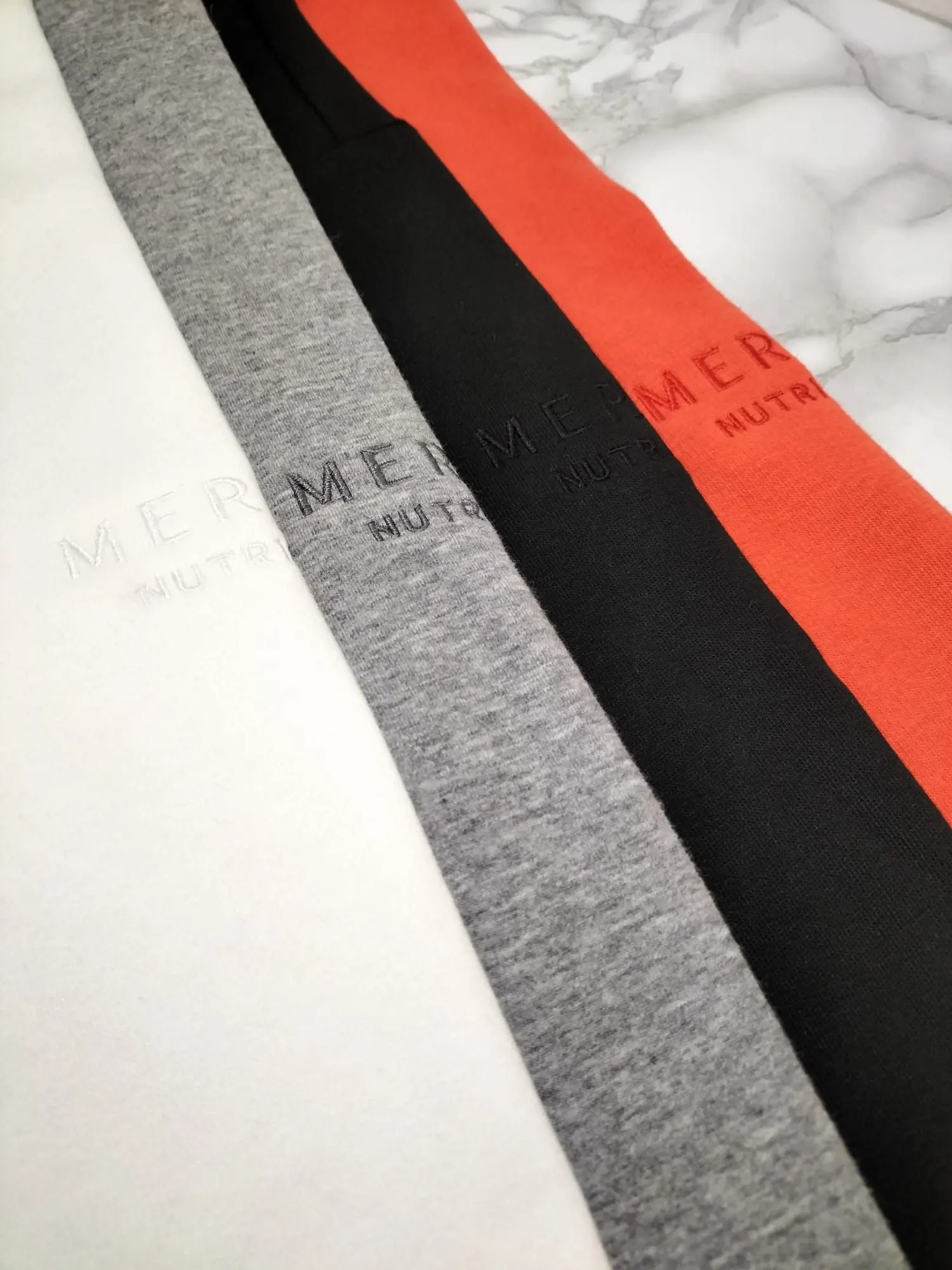 Embroidered sweaters for a nutrition brand
