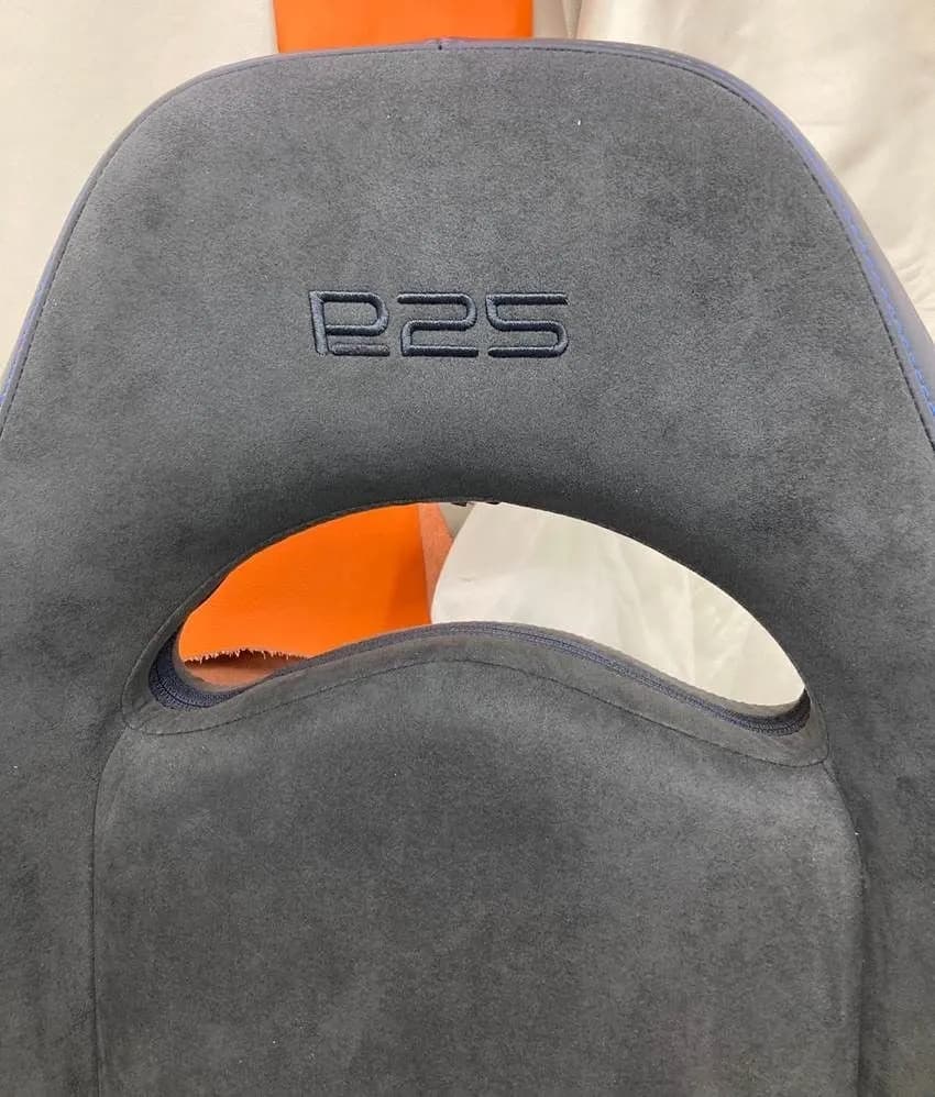 Embroidered sports car headrest