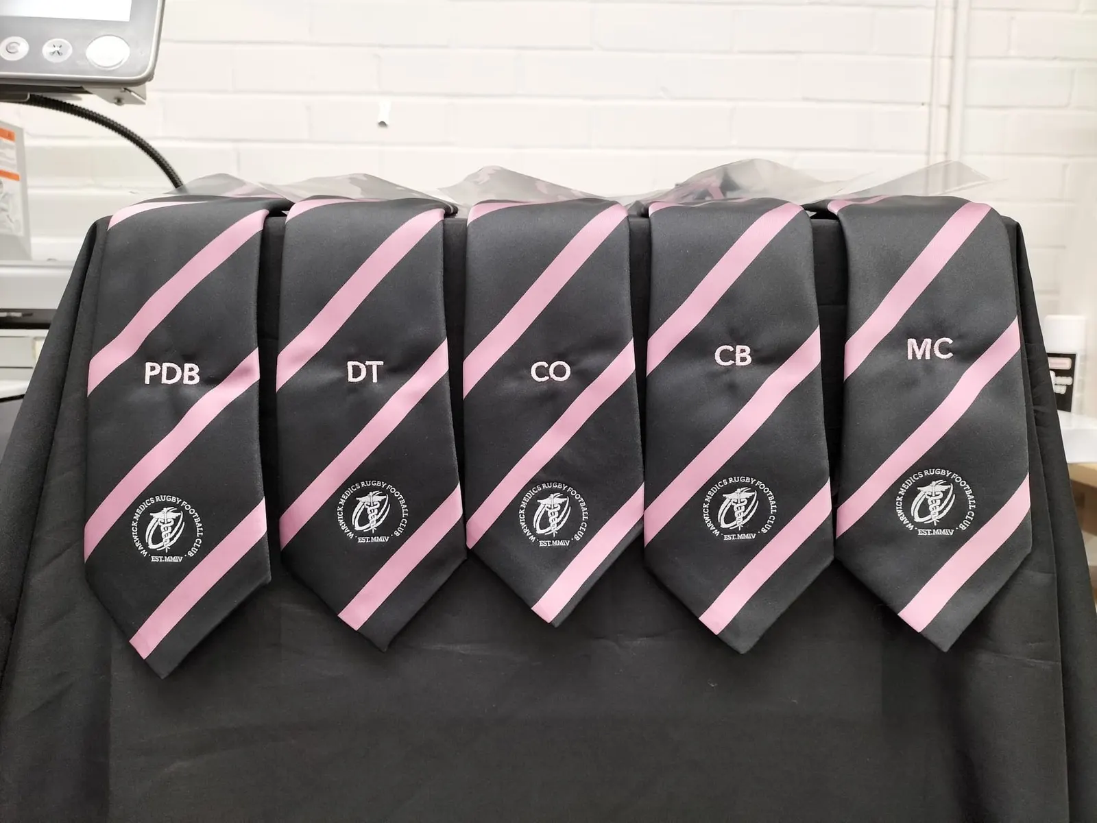 Gents' ties with embroidered initials